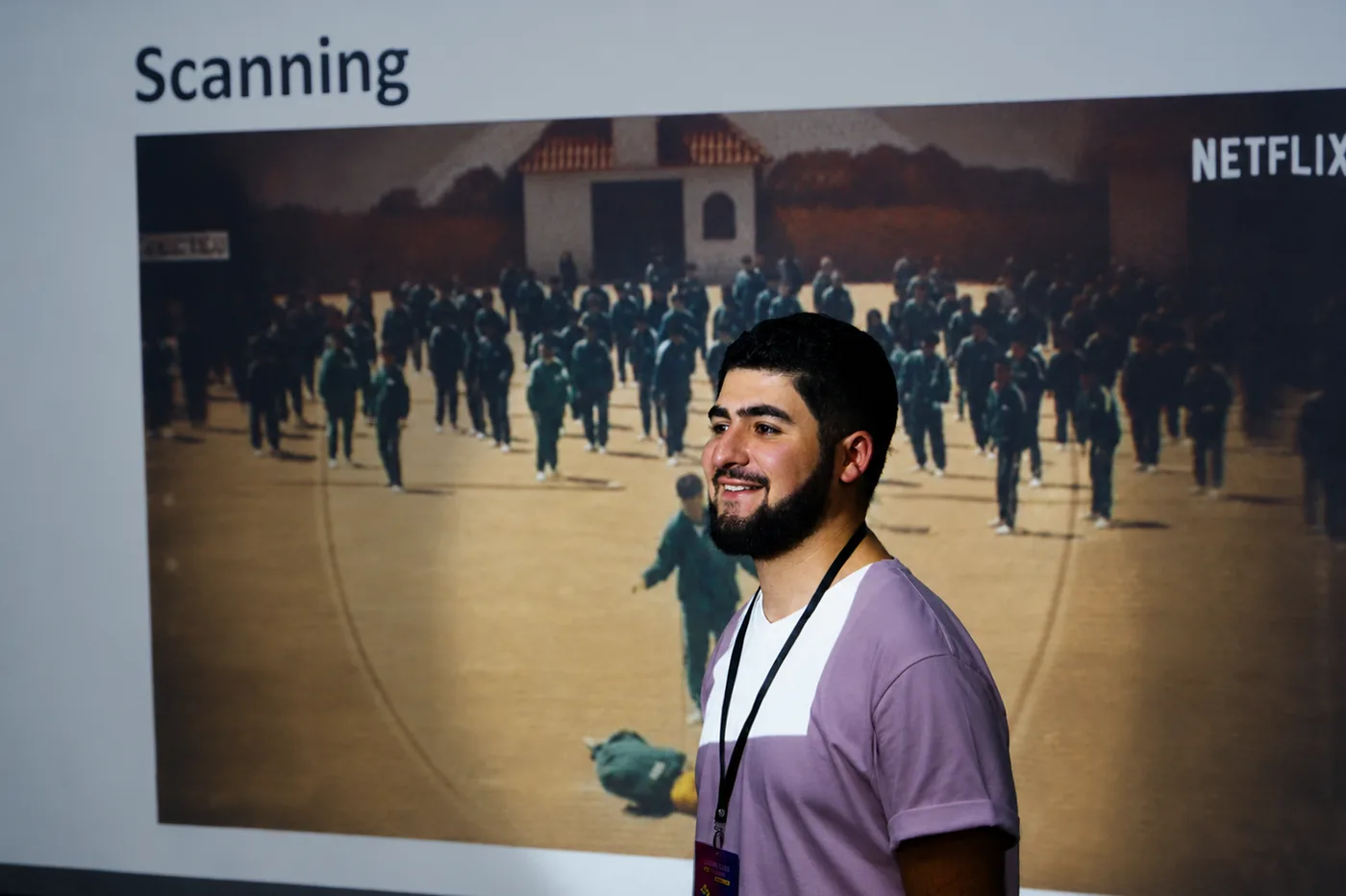 Samvel Antapyan speaking in front of a slide titled Scanning